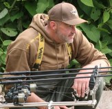 Carp Fisherman wearing Vass Hoodie Cap and Waders